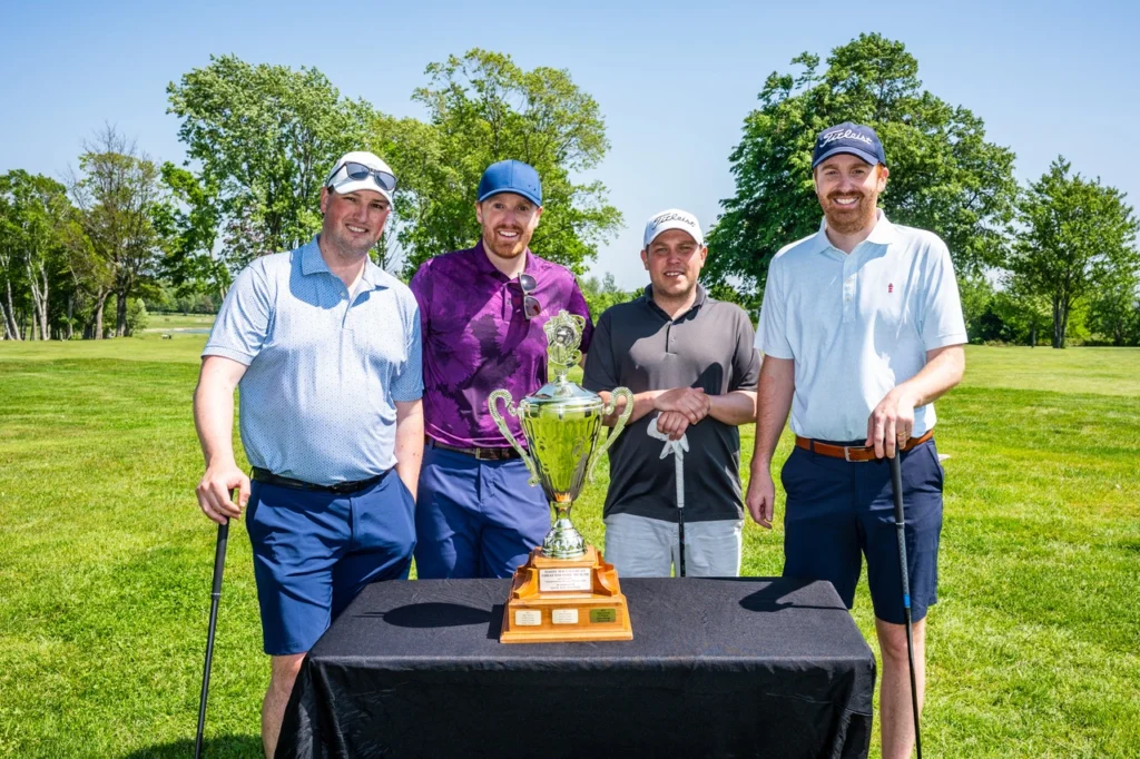 Members of Team Coach Atlantic pose with the tournament trophy